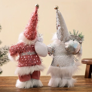 Standing 9-inch Santa figurines in pink and silver sequins with soft faux fur trim
