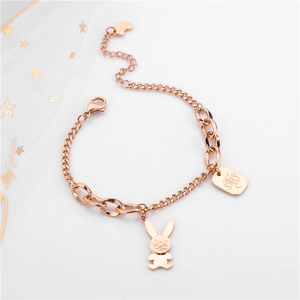 Detail view of rose gold bunny pendant with square tag on a stainless steel bracelet