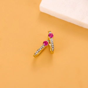 Detailed close-up of gold titanium earrings with rose red zircon stones and white crystals