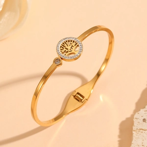 Detail of 18K gold-plated Tree of Life bangle with sparkling pave zircon settings