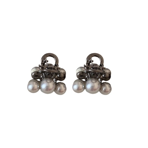 Set of two mini pearl bow hair claws with gun-black metal finish for stylish side bangs