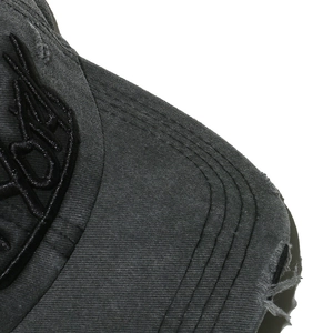 Detailed macro view of distressed cotton baseball cap with New York star embroidery