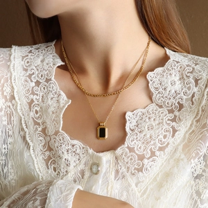 Double-layered gold titanium steel necklace with black acrylic pendant and snake chain