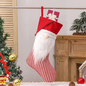 Christmas stocking with red and white striped gnome design and long beard tree decoration