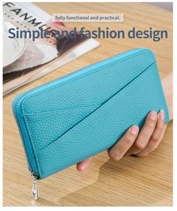 Lake blue leather wallet featuring a stylish pebbled texture and silver zipper detail