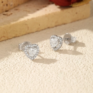 Sparkling S925 sterling silver heart stud earrings with moissanite center stone on stone base