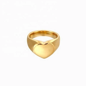 Golden heart-shaped signet ring with a polished minimalist zircon design