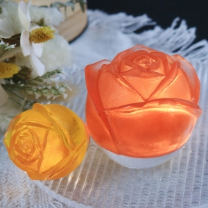 Detailed macro view of pearlescent translucent rose flower resin art on a glass tray