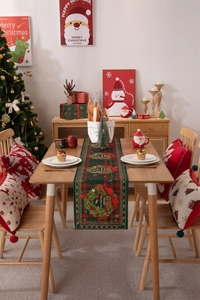Christmas table runner with Merry Christmas wreath print in a festive home setting