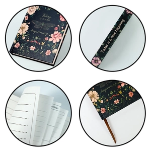 Detail view of floral hardcover notebook featuring silk bookmark and gold engraved quotes