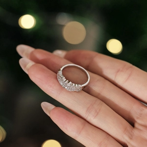 Detailed view of elegant silver eternity ring with double-row sparkling zircons on hand