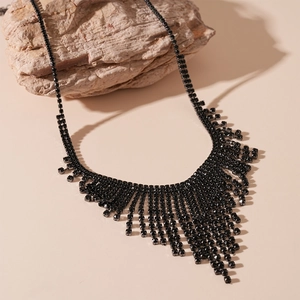 Elegant black rhinestone tassel necklace with V-shaped fringe on natural stone base