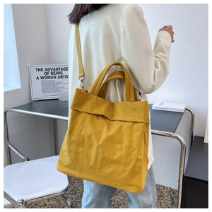 Modern ginger yellow nylon tote bag styled with casual outfit for a chic look