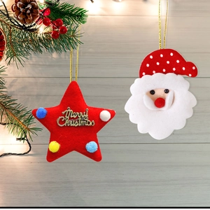 Plush Christmas star pendant with Santa Claus ornament on white wooden background with lights