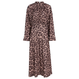 Detailed close-up of leopard print dress featuring high neck collar and ruffled cuffs