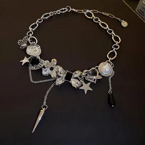 Silver punk Y2K necklace with butterfly, star and heart charms on brown background