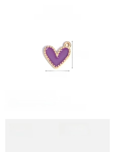 Detail of purple enamel heart pendant with 11x13mm size specifications and gold alloy trim