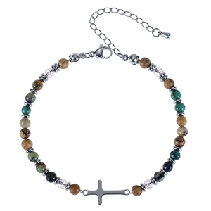 Detail of beaded wave bracelet with natural stones, cross charm and extension chain