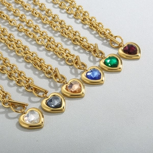 Detailed view of heart pendants with colorful crystal glass stones and golden OT toggles