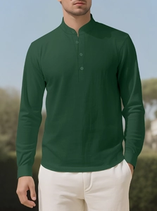 Detail of deep green linen shirt fabric with mandarin collar and buttoned placket