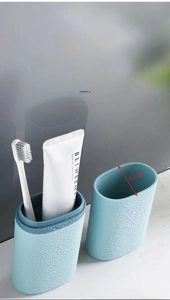 Close-up of portable blue travel toothbrush case with 4.5cm diameter and non-slip texture