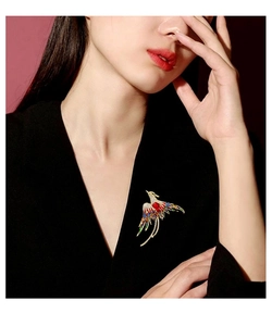Elegant Chinese style phoenix brooch with colorful enamel and rhinestones on a black outfit