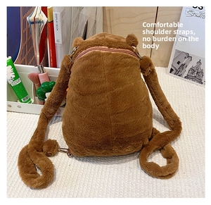 Detail showing the adjustable plush shoulder straps of the brown Capybara backpack