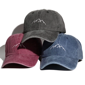 Washed cotton baseball caps in grey, burgundy, and navy with mountain embroidery design