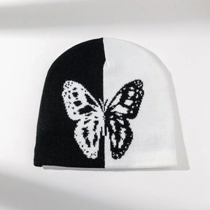 Fashionable butterfly knit beanie with contrast black and white patterns for winter warmth