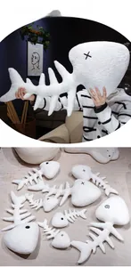 Detail of cartoon fish bone plush pillows in various sizes on a minimalist sofa