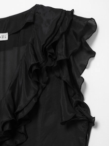 Detailed view of black ruffle sleeve dress with size M tag on a woven fabric garment