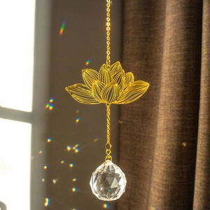 Golden metal lotus suncatcher with a multifaceted crystal ball prism for windows