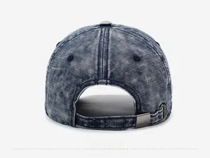 Detail view of the back of a vintage washed denim baseball cap with a metal buckle