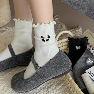 White mid-calf women's socks with lace trim and embroidered bow in Japanese Mori style