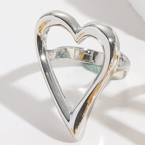 Detail shot of a polished silver hollow heart ring with minimalist metallic design