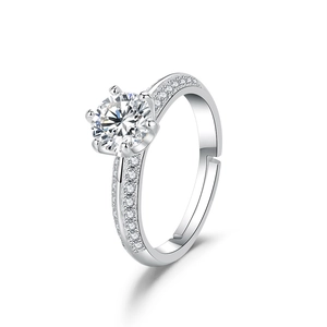 Detail of six-prong moissanite ring with pave set stones and adjustable band