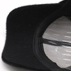 Macro detail of plush faux fur baseball cap showing inner lining and shape support
