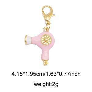 Pink enamel hair dryer charm with gold lobster clasp and detailed size parameters