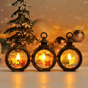 Detail of three bronze Christmas LED lanterns with Santa and reindeer scene engravings