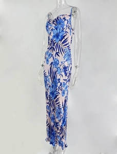Detailed close-up of pleated tropical floral print fabric on slim fit midi dress