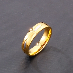 Detail view of 18k gold plated titanium ring with silver leaf pattern and polished finish