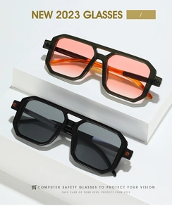 Detail of square double-bridge sunglasses with gradient lenses on minimalist display