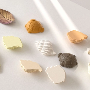Mini shell and turtle resin molds for DIY keychain pendants in varied natural earth tones