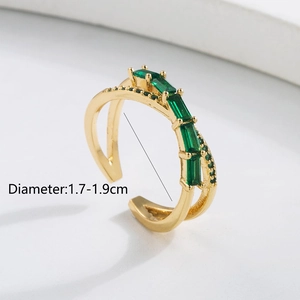 Detail view of 18K gold ring with green zircons showing adjustable 1.7-1.9cm diameter