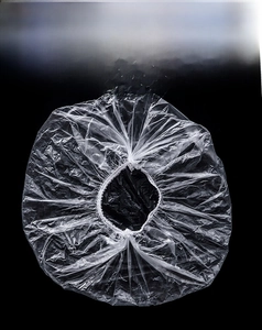 Detail of disposable transparent food cover with elastic band for kitchen freshness