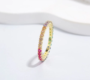 Macro view of gold-plated 925 silver eternity ring with colorful 4mm round zircons