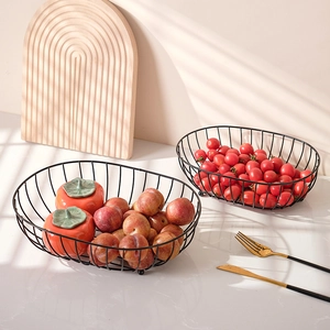 Nordic black iron wire fruit baskets for living room set of two on marble surface
