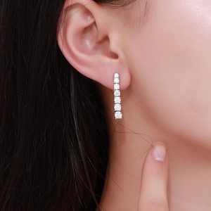 Elegant long moissanite tassel drop earrings for women with a minimalist silver finish