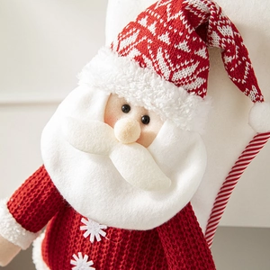 Red and white knitted Santa Claus gift bag hanging decoration with plush fabric texture