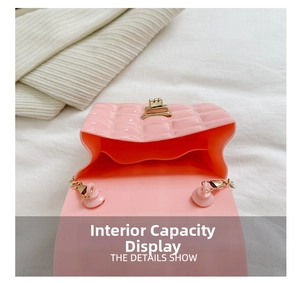 Detailed interior view of pink jelly bag showing PVC texture and golden chain strap